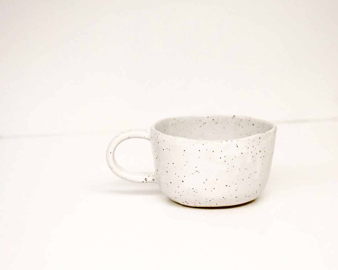 a cup / speckled white